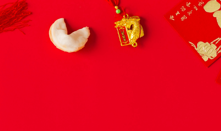 Lunar New Year bento lunchbox accessories including festive food picks, red silicone cups, and themed containers for kids’ lunches.