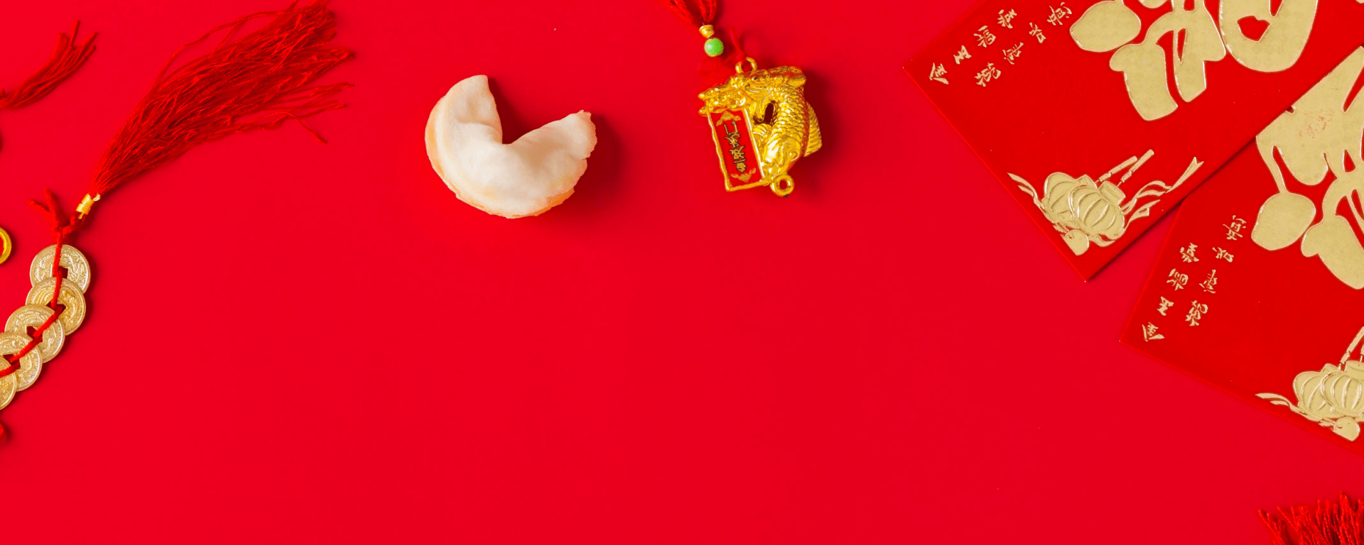 Lunar New Year bento lunchbox accessories including festive food picks, red silicone cups, and themed containers for kids’ lunches.