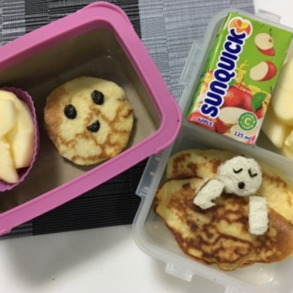 Pancakes and apple juice in this kids snack box.