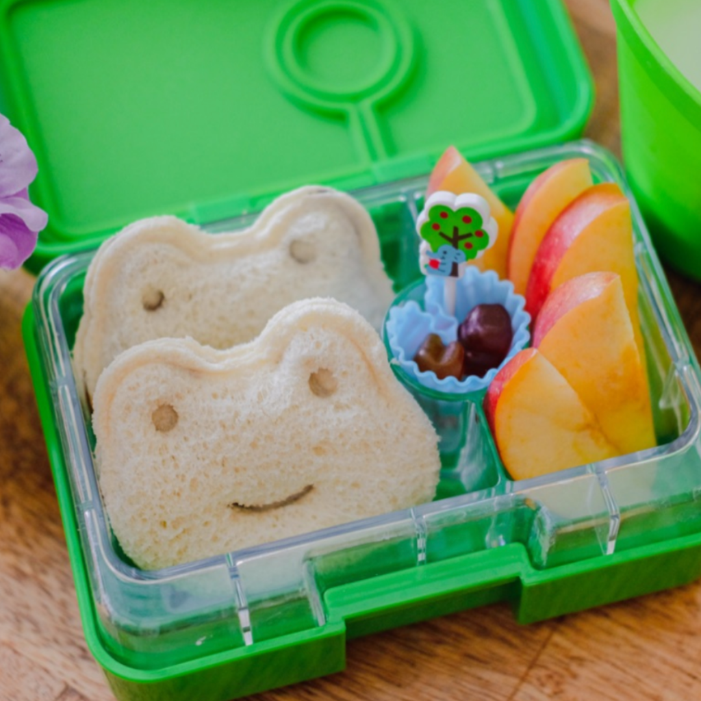 Kids snack box idea with apple slices and sandwiches