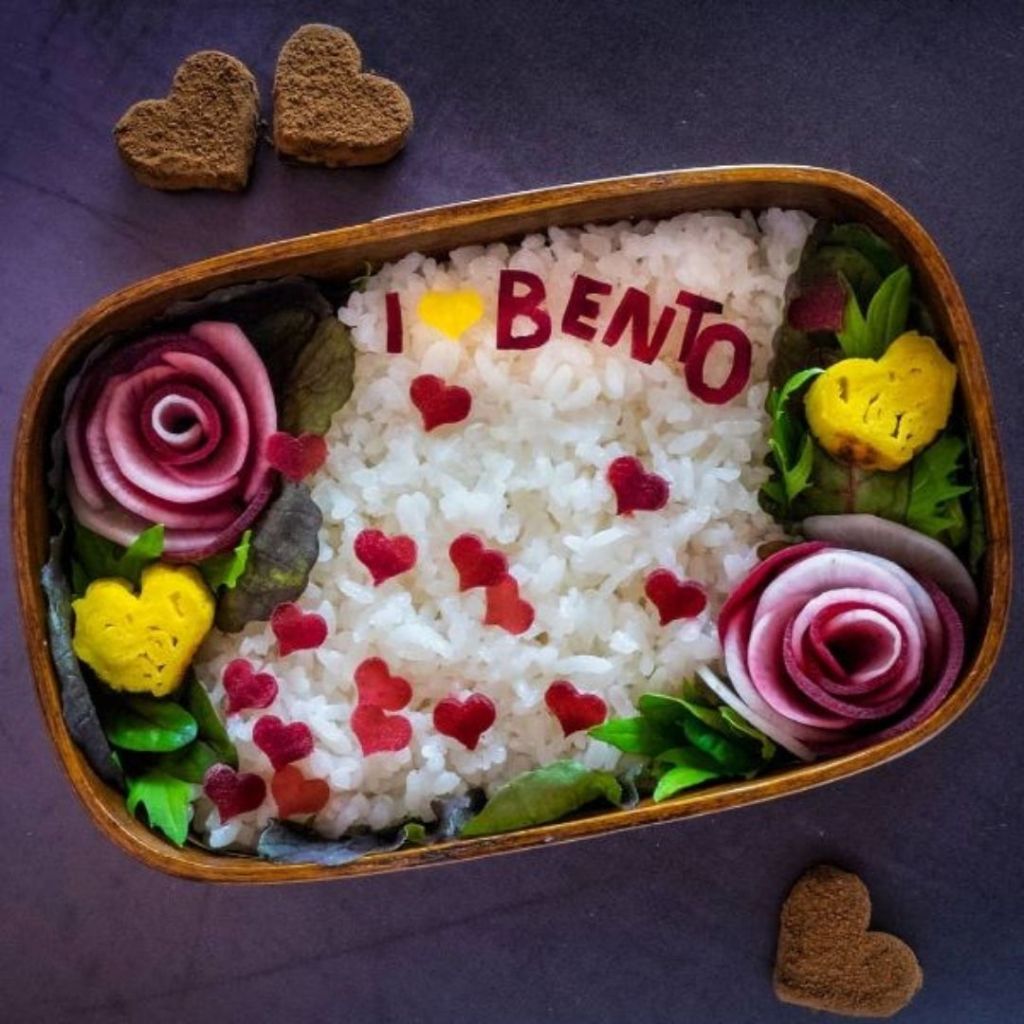 @idontlikechocolatebrownies cut slices of red and white beets and assembled them as beautiful roses! Tiny hearts and text "I love Bento" were cut out of beets too!