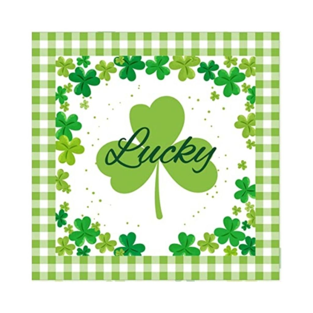 Green napkin with shamrocks and the word Lucky written on it for celebrating St. Patricks' Day