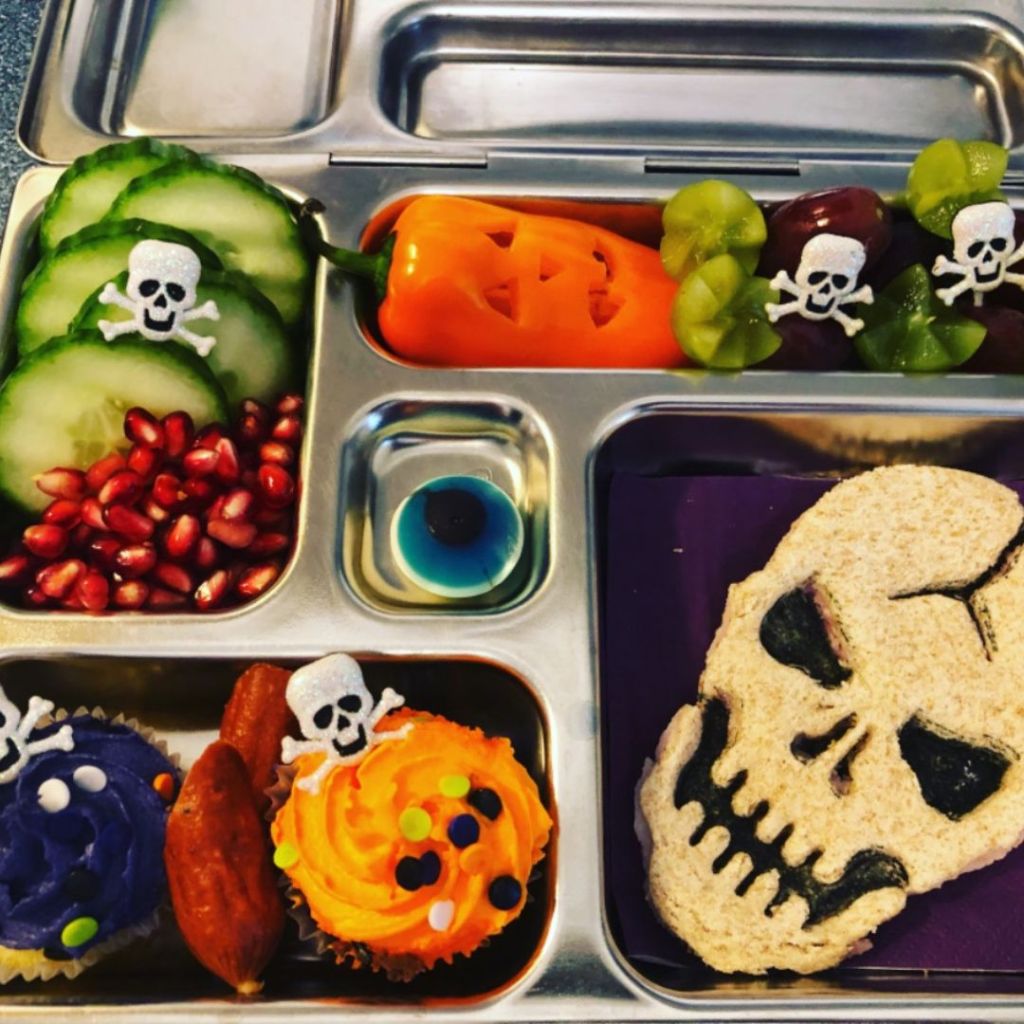 A kid bento school lunch celebrating Halloween with cupcakes