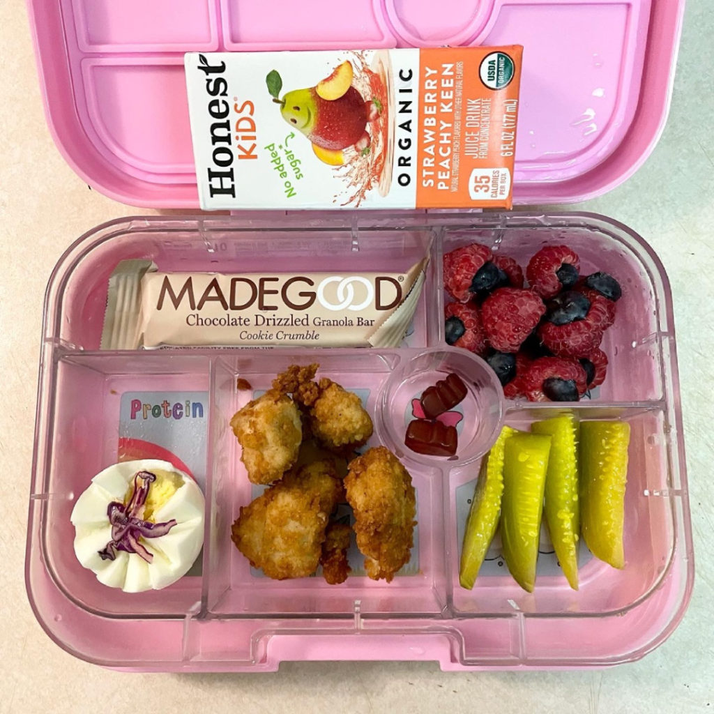 kids' lunch in a bento lunchbox with madegood granola bar for snack