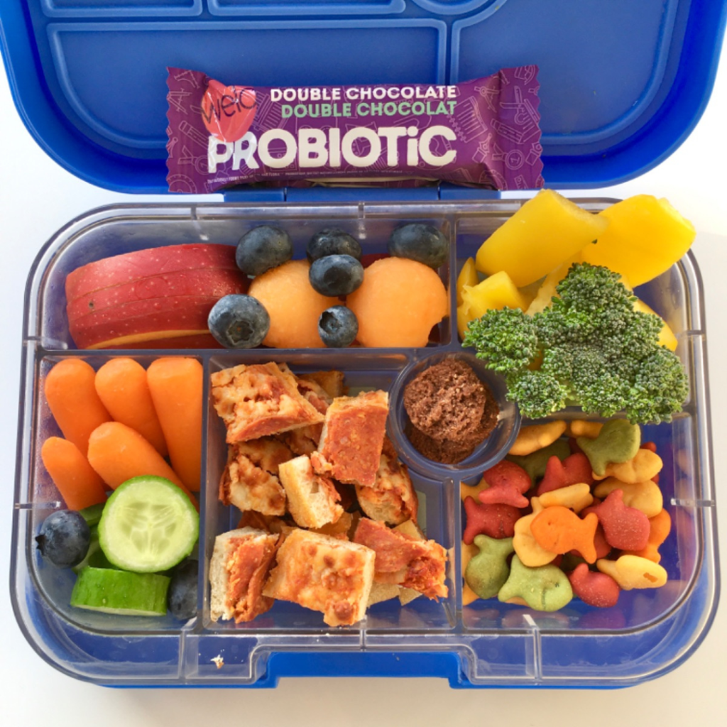 pizza and veggies for kids' lunch in a bento lunchbox with welo granola probiotic bar for snack