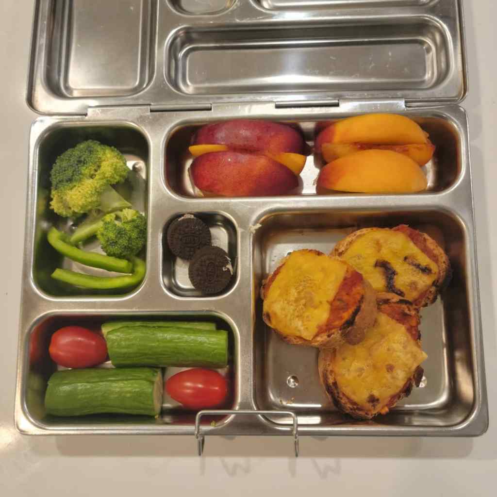 Planetbox lunchbox for kids with mini pizzas, fruits and veggies