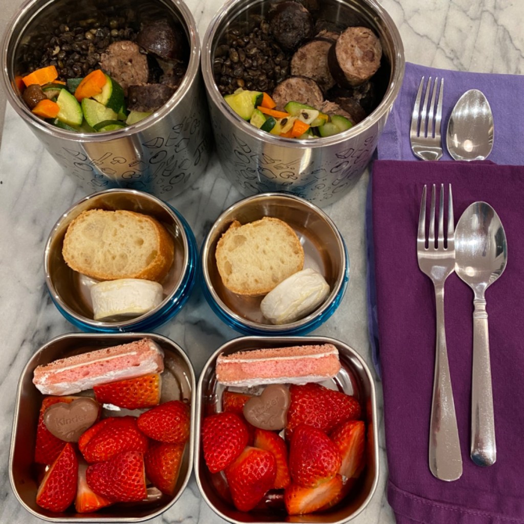 Petit salé for kids' meals at school in thermos with black lentils duck sausage and vegetables