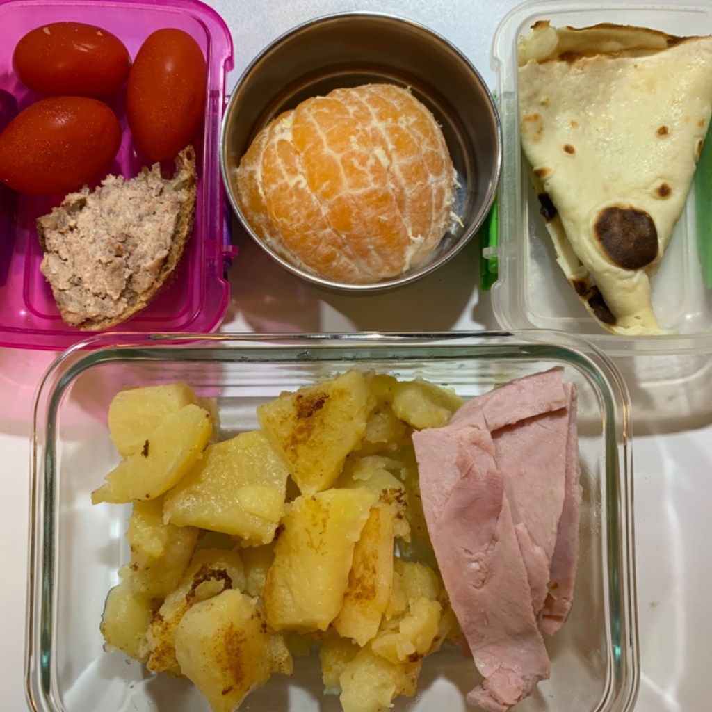 Garlic roasted potatoes with ham in a kid's lunchboc
