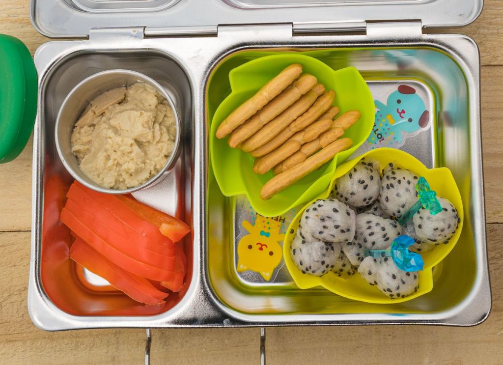 Veggies and hummus in a kid's snack box