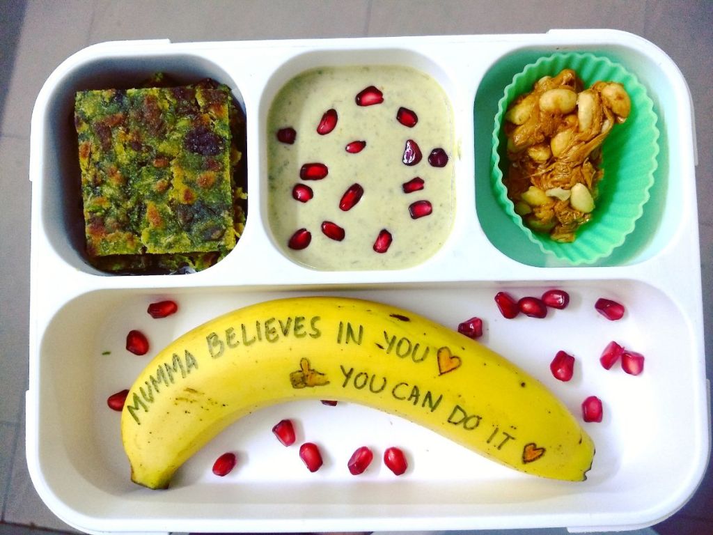 Lunchbox note written on a banana in a kid's lunchbox 