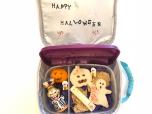 Cheese stick ghost in a kids lunchbox for Halloween