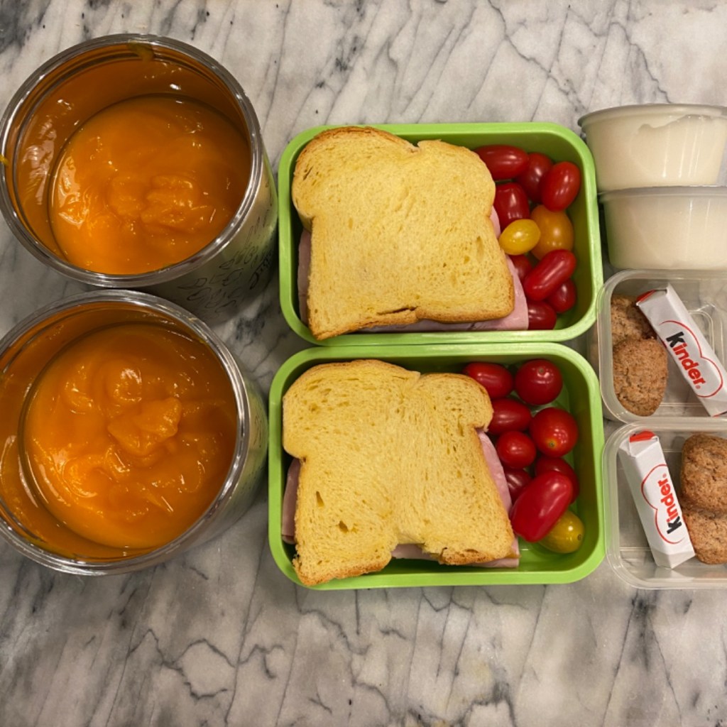 Cozy pumpkin soup and sandwich for a kid's lunch at school