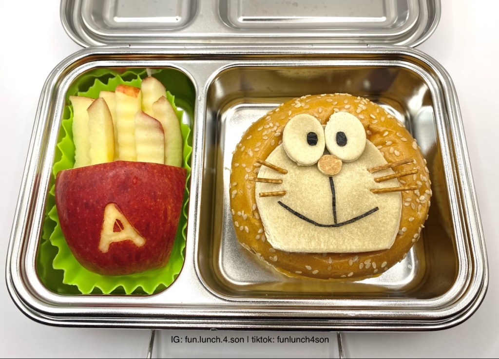 Apple French Fries and Doraemon Sandwich in a stainless steel lunchbox for a fun lunchtime at school.