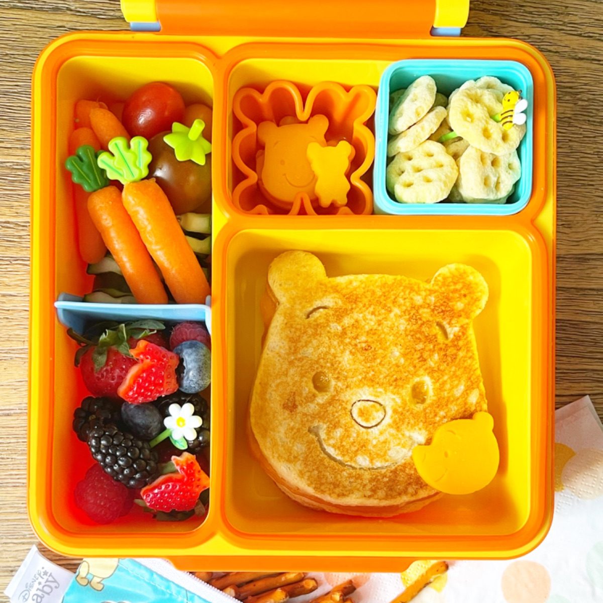 Winnie the Pooh grilled cheese sandwich in a yellow lunchbox