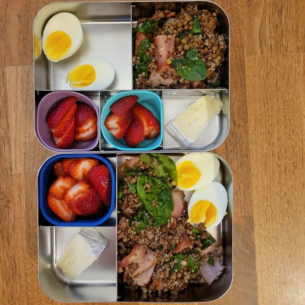 Lentil salad packed in a lunchbox to represent abundance and prosperity.