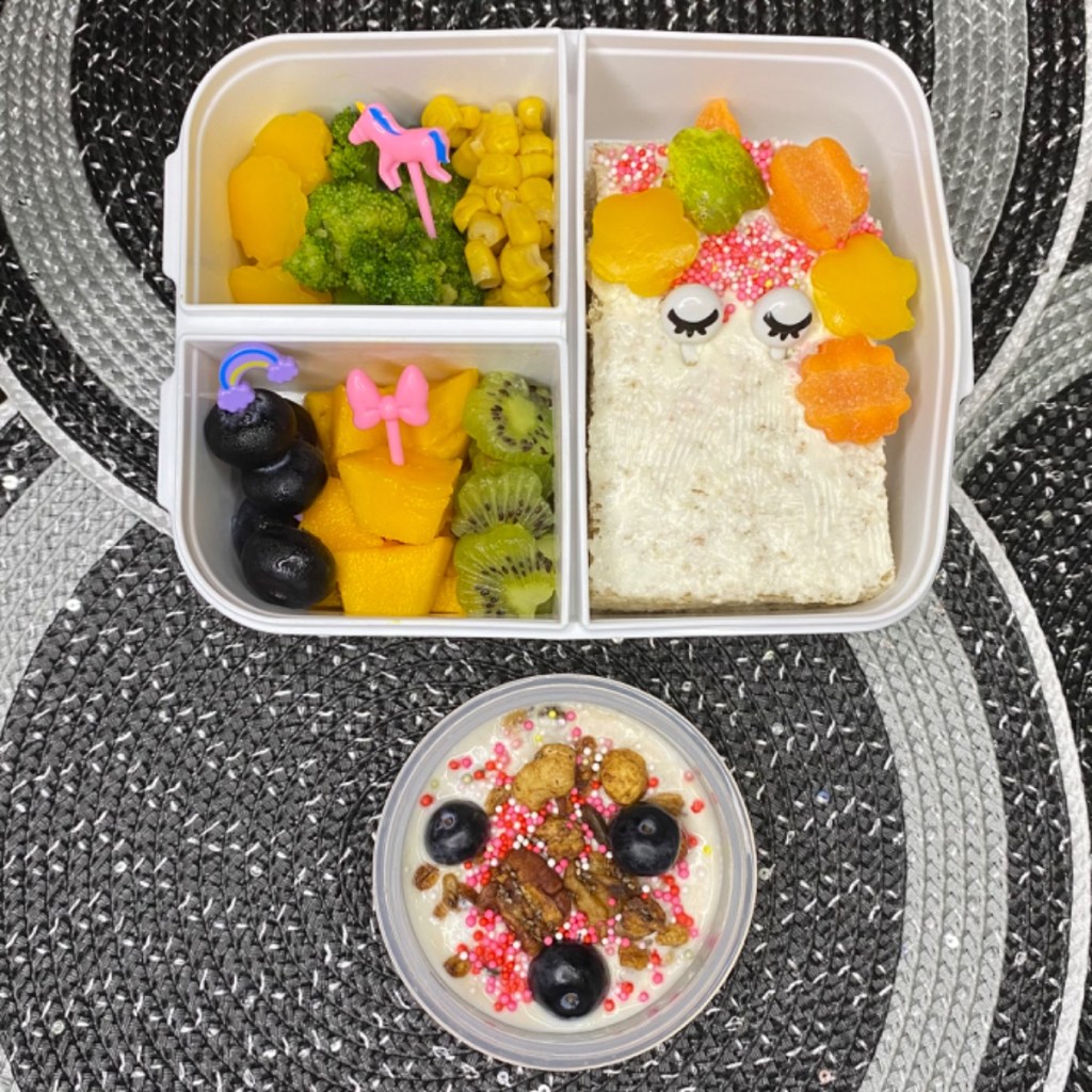 Unicorn themed lunchbox idea for kids, with a berry good yogurt parfait for dessert