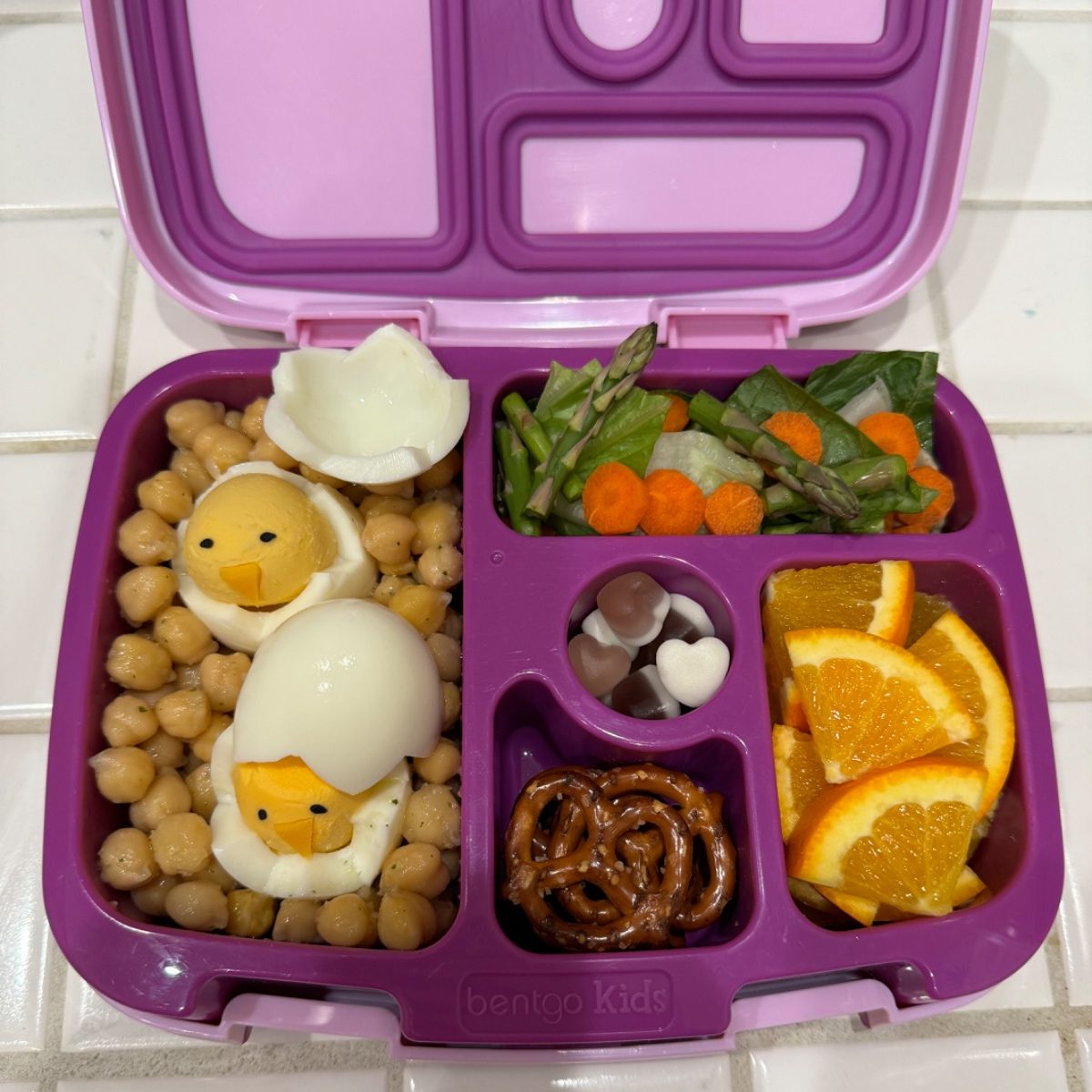 Cute Boiled-Egg Baby Chicks on a bed of chickpeas in a purple Bentgo kids bento lunchbox for Easter