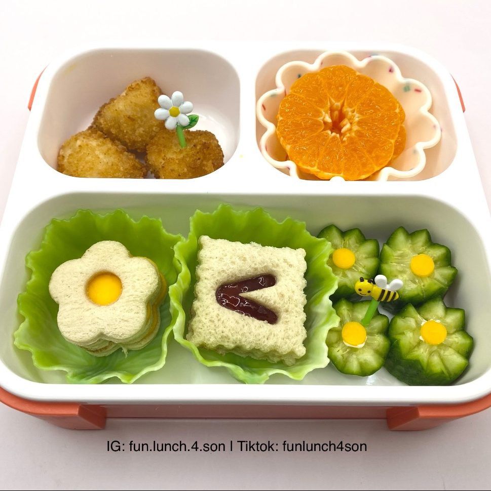 Cucumber carved as flowers in a kid's lunchbox