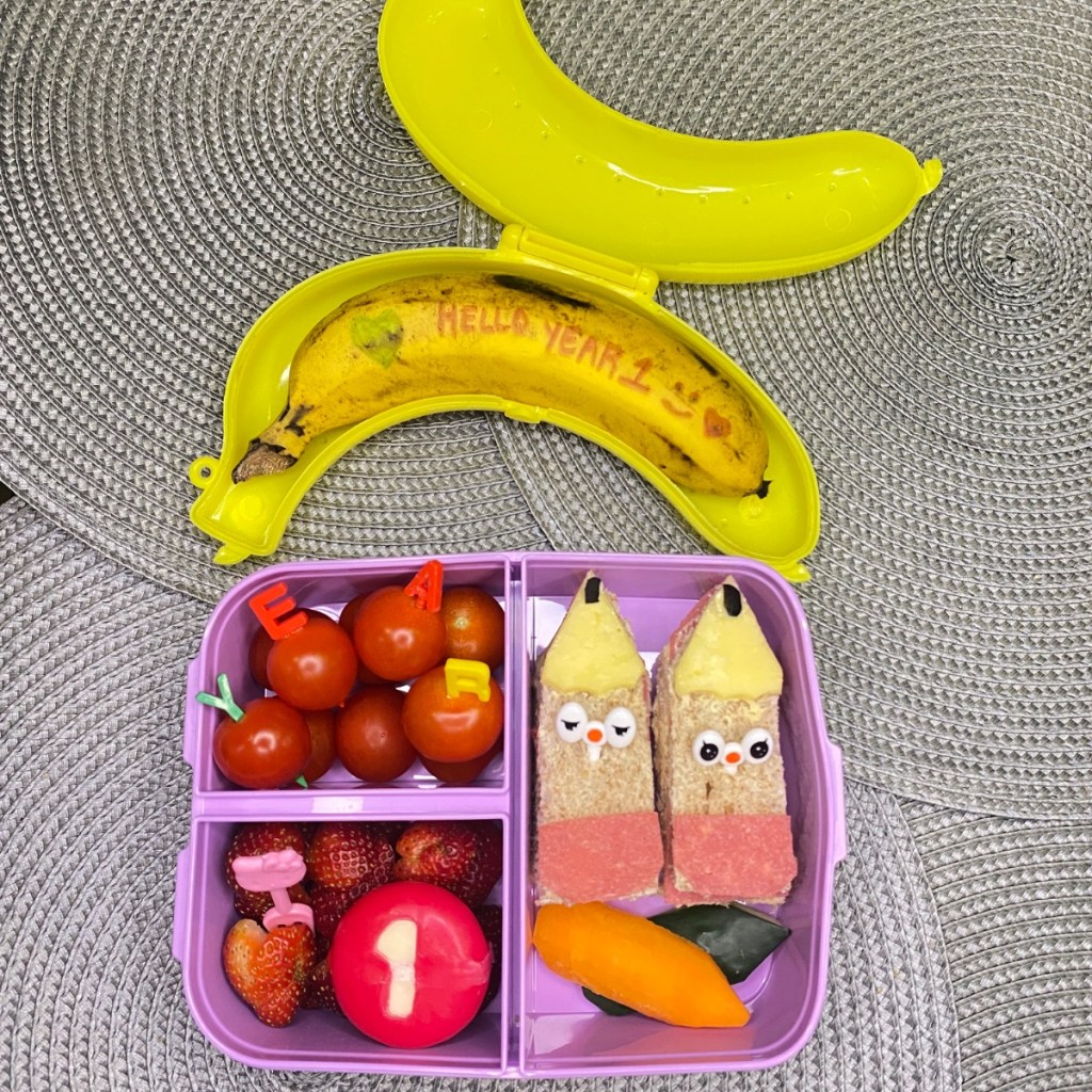 Love message written by a parent for a kid on a banana for a happy lunchbox